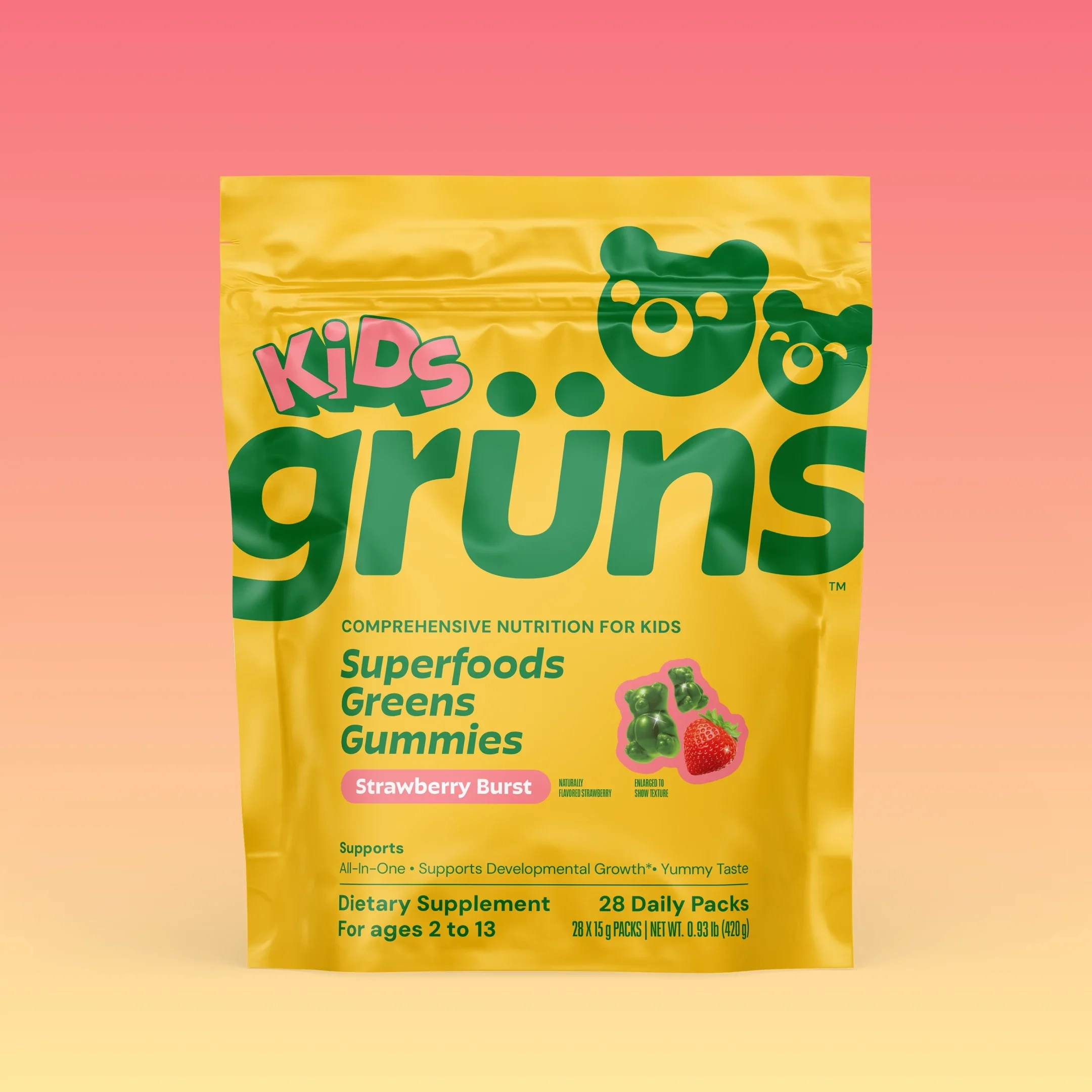 Grüns Original Kids pouch on a pink-to-yellow background